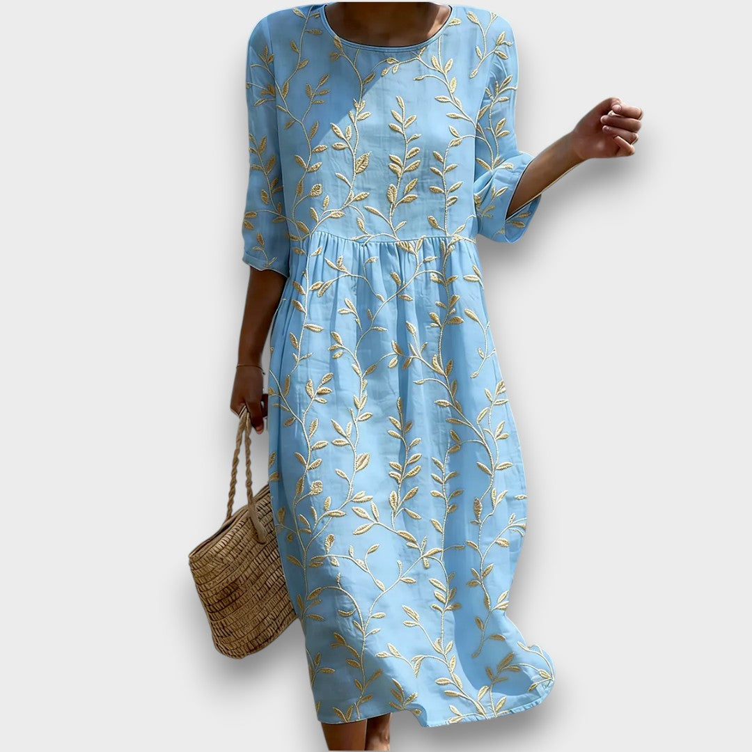 Natalie | Midi dress with round neckline and plant and flower print