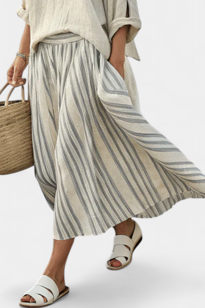 Aurora – Comfortable blouse and striped midi skirt