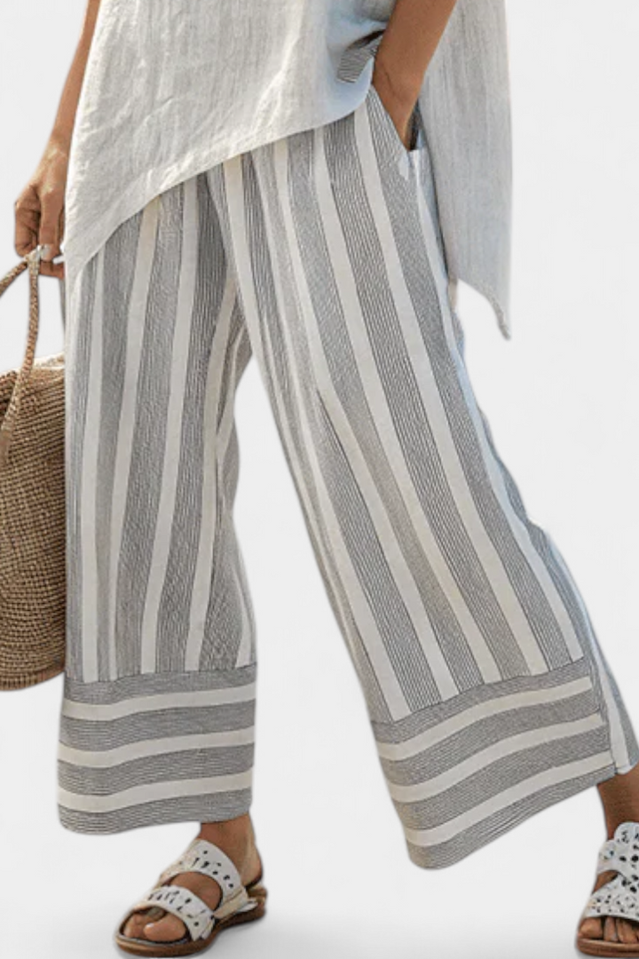 Fiorella – Elegant asymmetric blouse and striped pants